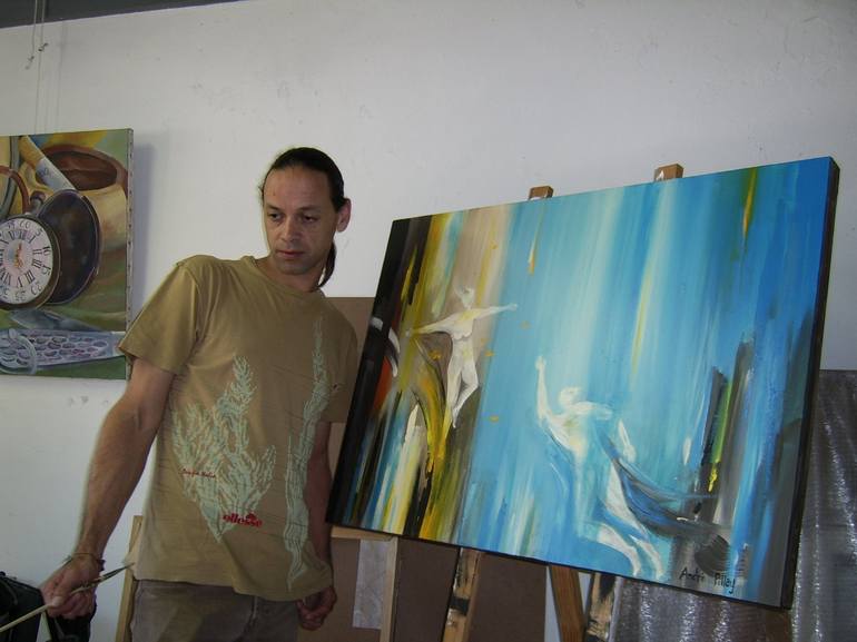 Artist with painting in studio - André Pillay